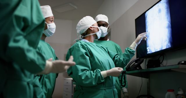 Team of Surgeons Analyzing X-ray in Operating Room - Download Free Stock Images Pikwizard.com