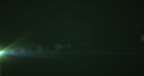 Abstract Green Light Flares on Dark Background - Download Free Stock Images Pikwizard.com