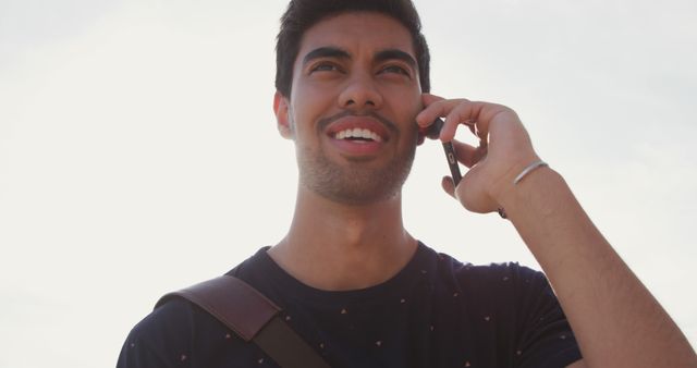 Happy Young Man Talking on Smartphone Outdoors - Download Free Stock Images Pikwizard.com