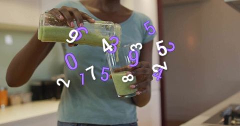 Pouring green smoothie with floating numeric overlay for nutrition tracking and wellness