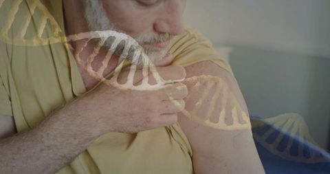 Senior man showing vaccine patch on upper arm with dna double helix overlay for gene therapy study