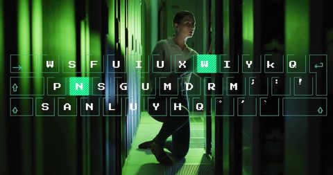 Tech professional examining servers in futuristic data center