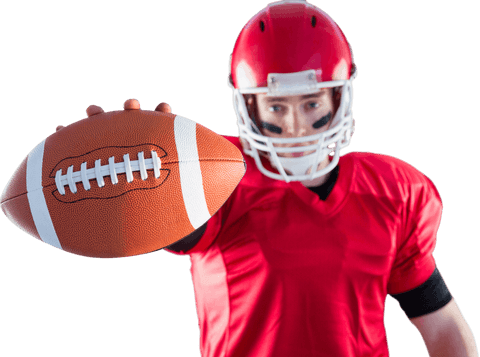 Focused american football player in red gear holding ball transparent background