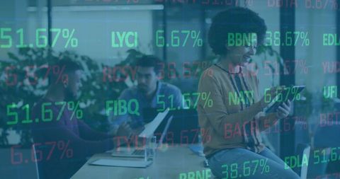 Curly-haired woman using tablet in collaborative office with stock ticker overlay