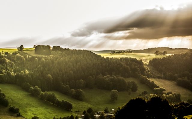 Sunset Over Lush Green Hills and Valleys with Dramatic Cloud Cover - Download Free Stock Photos Pikwizard.com
