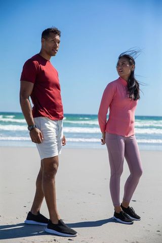 Active Friends Enjoying Beach Workout Experience in Stylish Activewear