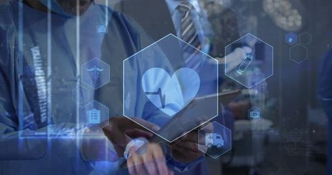 Medical professionals interacting with holographic medical interfaces