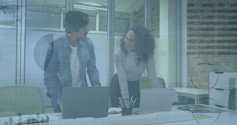 Innovative professionals analyzing financial data in tech office
