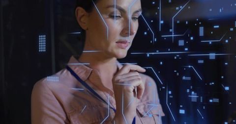 Female engineer interacting with holographic interface in futuristic control hub