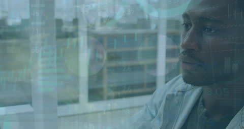 Businessman Analyzing Data Charts in Office Environment