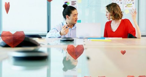 Creative Interaction in Modern Office with Overlayed Hearts