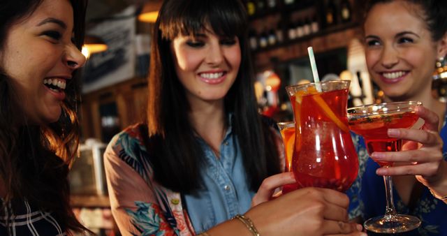 Women Friends Enjoying Cocktails at Bar - Download Free Stock Images Pikwizard.com