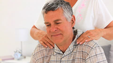 Senior Couple Enjoying Relaxing Home Massage