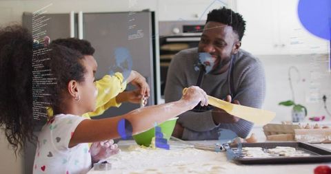 Family Baking: Father Helping Children Stretch Dough on Flour-Dusted Countertop