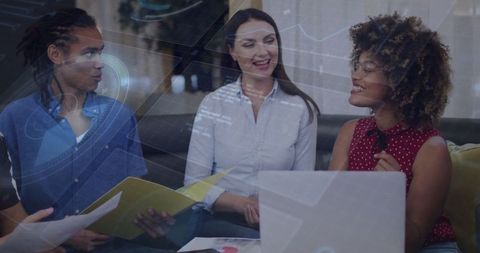 Diverse colleagues brainstorming session in modern office lounge