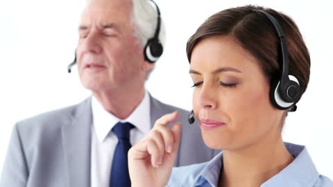 Business Team Wearing Headsets in Communication Setup