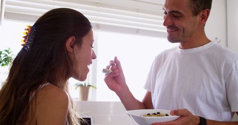 Couple Sharing Breakfast Together in Cozy Kitchen