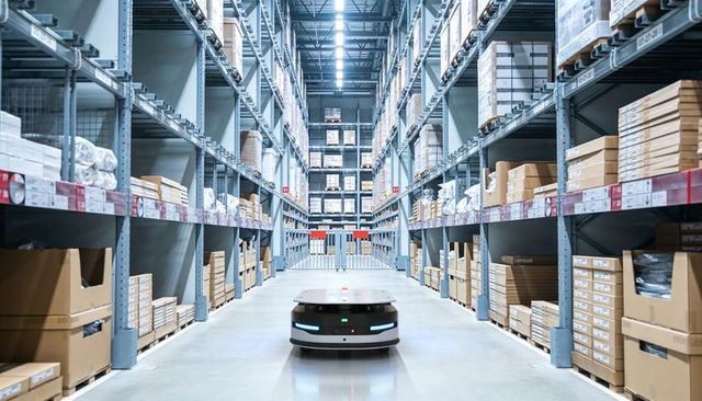 Autonomous warehouse robot navigating high-rack aisle for modern logistics efficiency