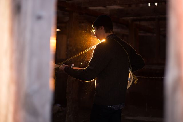 Man Playing Guitar Inside Rustic Cabin at Sunset - Download Free Stock Photos Pikwizard.com
