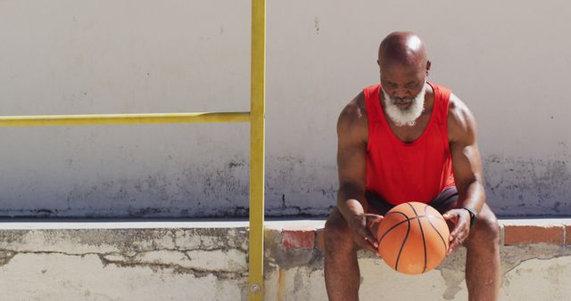 Senior Athlete Resting with Basketball in Urban Setting - Download Free Stock Images Pikwizard.com