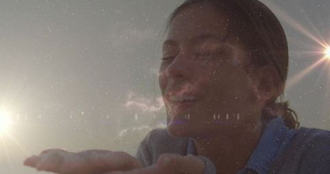 Ethereal Woman Holding Light Under Starry Sky with Lens Flare
