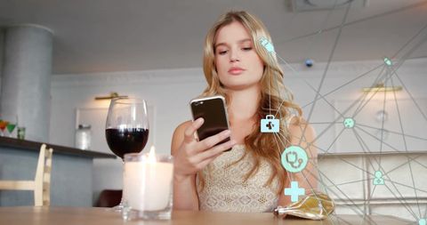 Woman Engaging with Smartphone in Modern Cafe Linked to Global Network