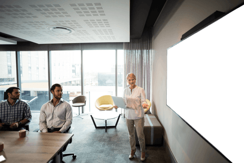 Businesswoman Leading Presentation with Transparent Display in Modern Office - Download Free Stock Videos Pikwizard.com