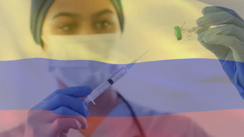 Healthcare Professional Preparing Vaccine with Overlay of Colombia Flag