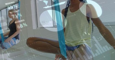 Practicing aerial silk balancing woman with mirror reflection and digital fitness overlay