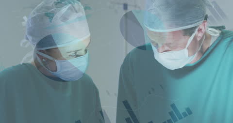 Surgeons Analyzing Data During operation