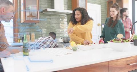 Woman Pointing and Directing Cooking During Friends Gathering in Bright Modern Kitchen