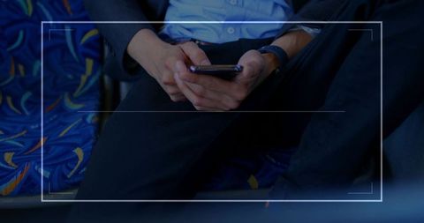 Business commuter using smartphone in public transit
