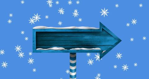 Winter Arrow Signpost on Snowy Day