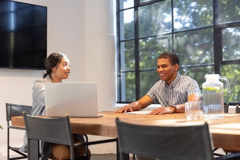 Diverse Coworkers in Modern Office Meeting Collaboration