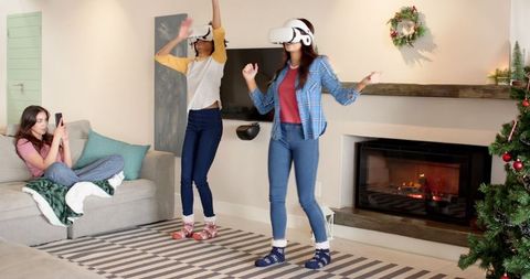 Diverse Friends Enjoying Virtual Reality during Festive Holiday Gathering