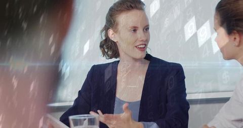 Businesswoman Gesturing During Office Meeting with Colleague