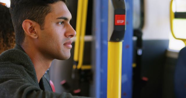 Young Man Traveling on Bus and Looking Out Window - Download Free Stock Images Pikwizard.com