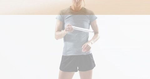 Woman holding white tube wearing fitted grey tee and black shorts minimal high-key fitness