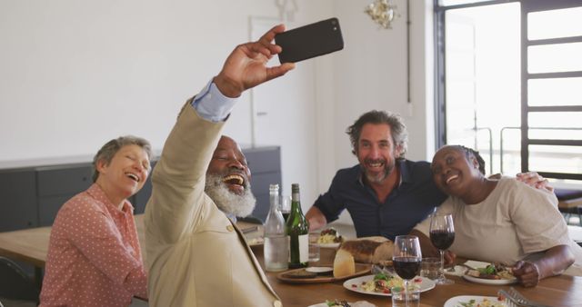 Diverse Group of Friends Enjoying Meal and Taking Selfie - Download Free Stock Images Pikwizard.com