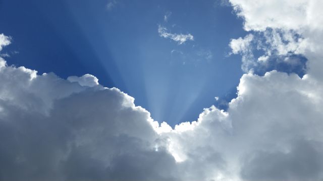 Beautiful Cloudscape with Sun Rays in Blue Sky - Download Free Stock Photos Pikwizard.com