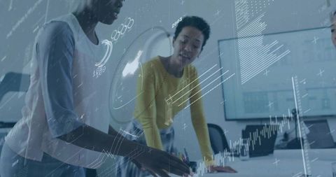 Colleagues Collaborating on Innovative Data Analysis in Modern Workspace