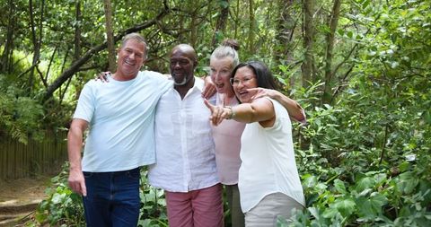 Diverse Friends Enjoying Nature Walk in Forest