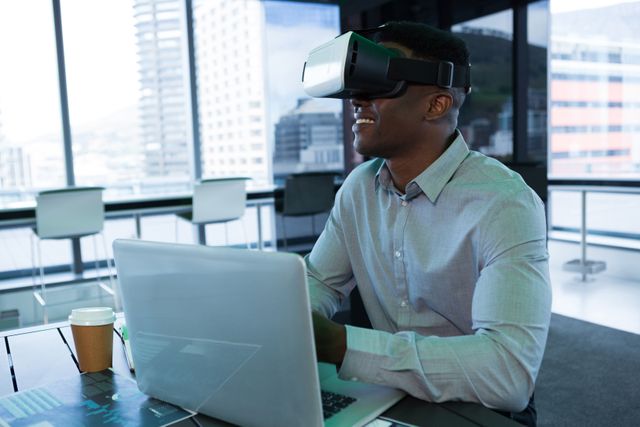 A businessman engages with a VR headset while working in a contemporary office setting. The scene is ideal for illustrating concepts related to modern technology, innovation in the workplace, professional development, and the integration of virtual reality in business.