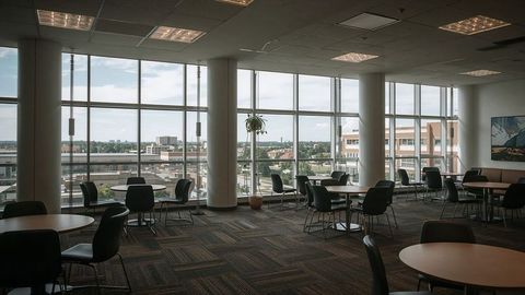 Corporate lounge with large windows and minimalist furniture design