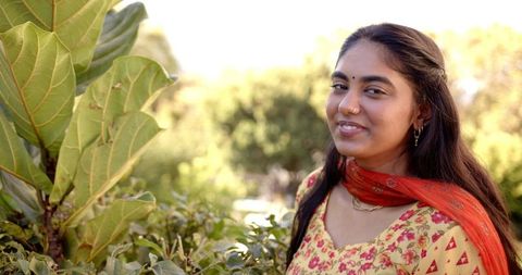 South Asian Woman Enjoying Nature in Vibrant Attire - Download Free Stock Images Pikwizard.com