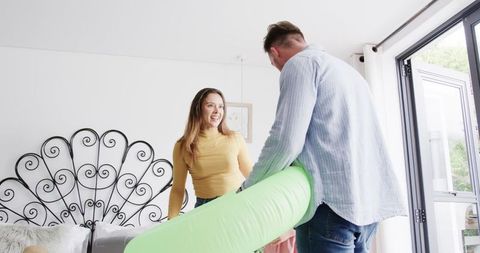 Family Packing for Summer Vacation at Home in Bright Bedroom