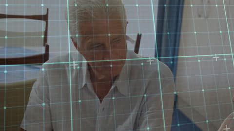 Senior Couple with Digital Overlay Interface in Discussion