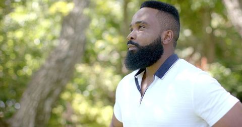 Confident man enjoying sunny garden hammock outdoors