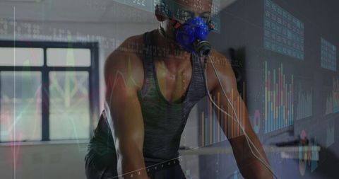 Male Athlete Wearing Respiratory Mask Cycling in Sports Science Lab