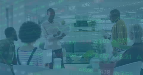 Diverse Team Analyzing Financial Trends in Lively Office Setting